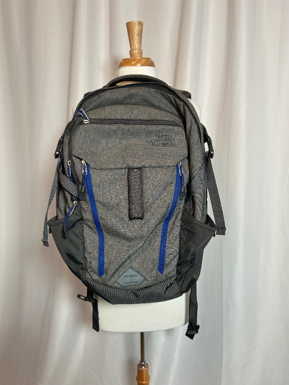 THE NORTH FACE SURGE BACKPACK IN GRAY WITH BLUE ACCENTS